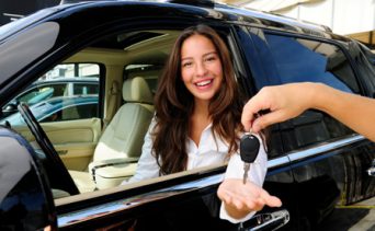 Woman purchasing a new car