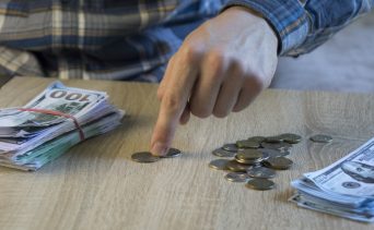 Counting out money for savings